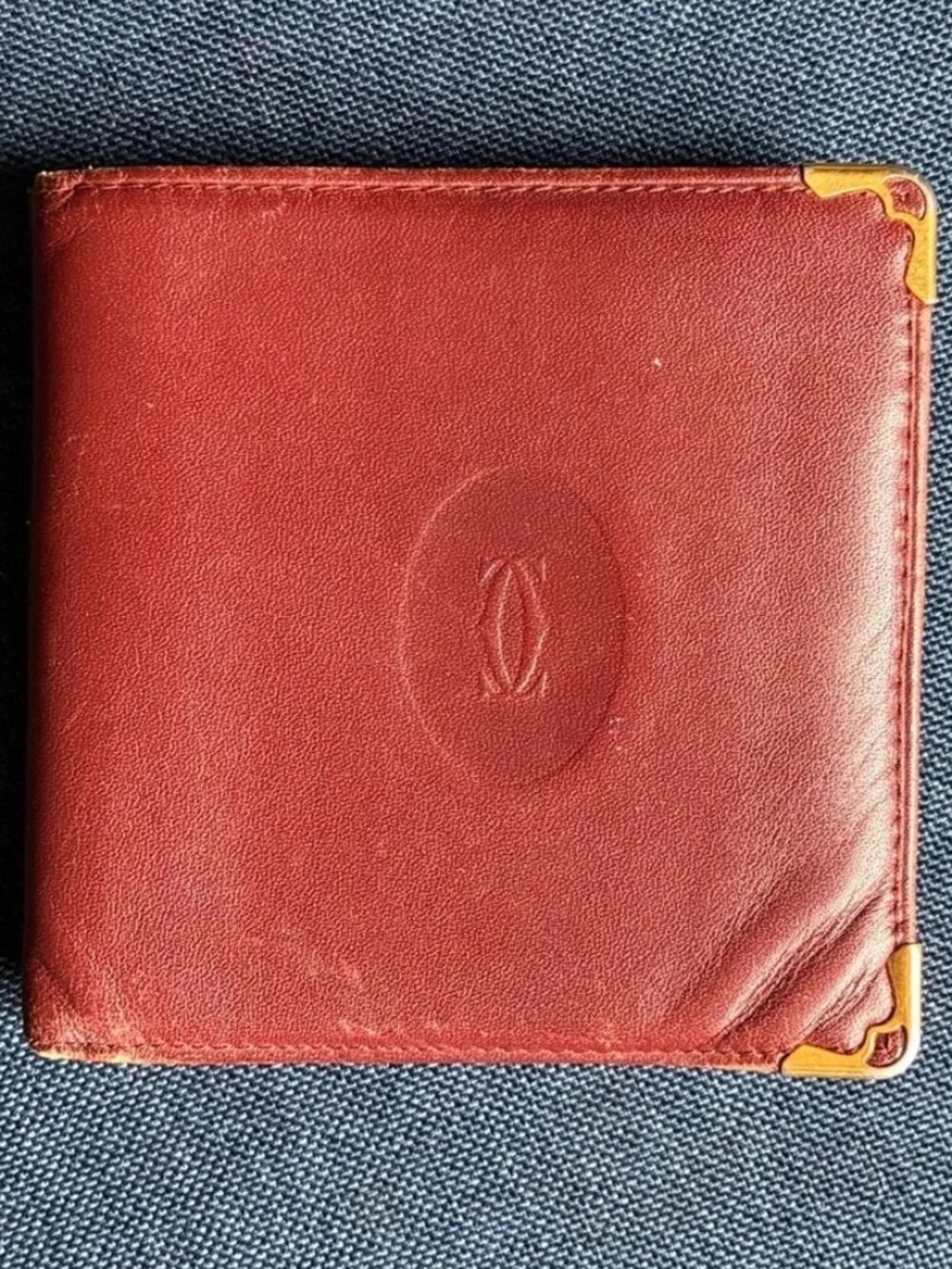 Cartier Red Leather Wallet with Gold Corner Accents